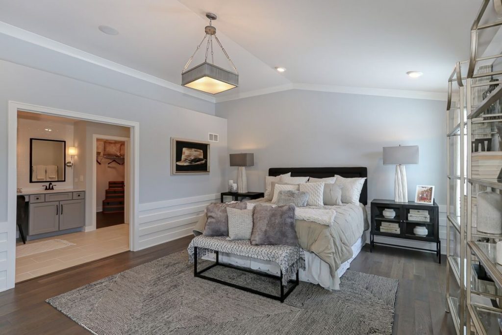 Bedroom with horizontal wainscoting.