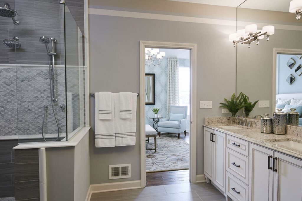 Bathroom with stripes painted on the wall.